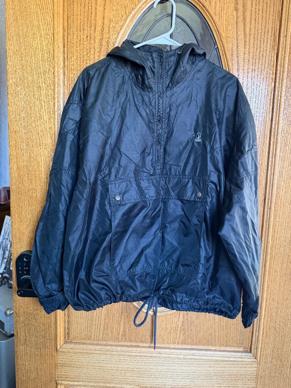 Izod black windbreaker jacket with hood and drawstring waist. Size L